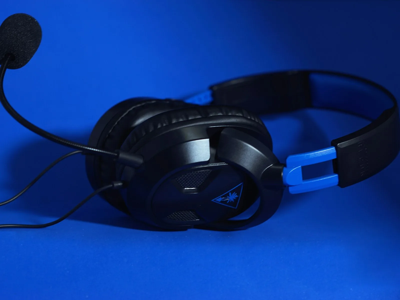 Headset on a blue surface, representing contact center work