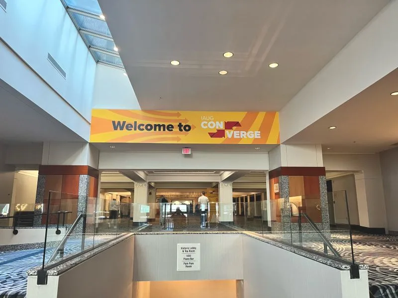 IAUG Converge welcome banner at the venue entrance